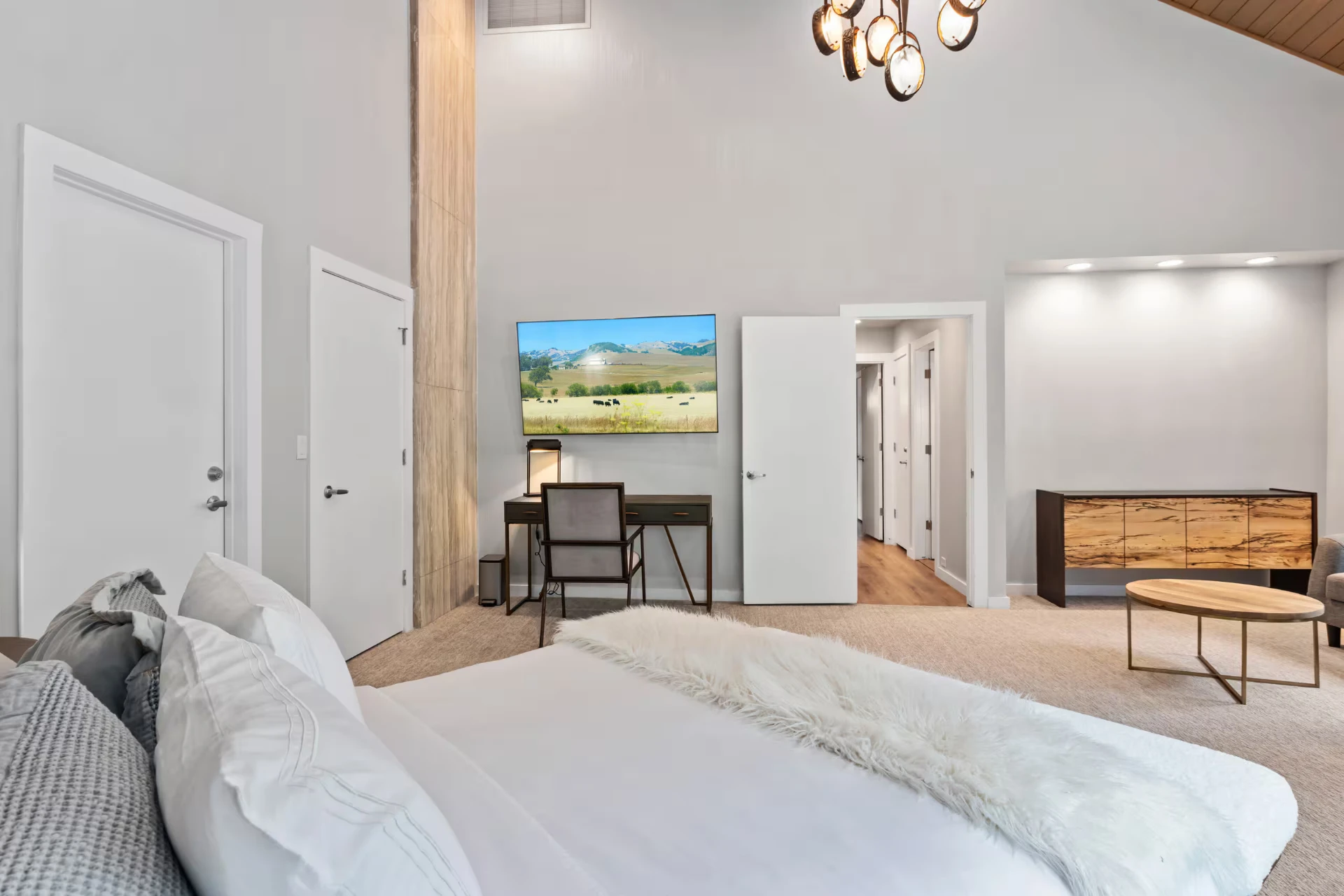 Bedroom with desk area and mountain view TV