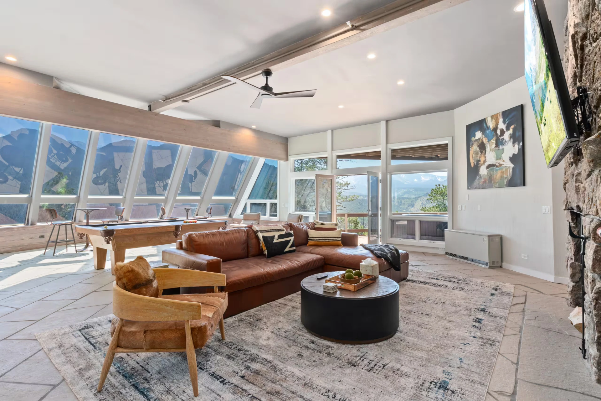 Lower level lounge with leather sofa and pool table