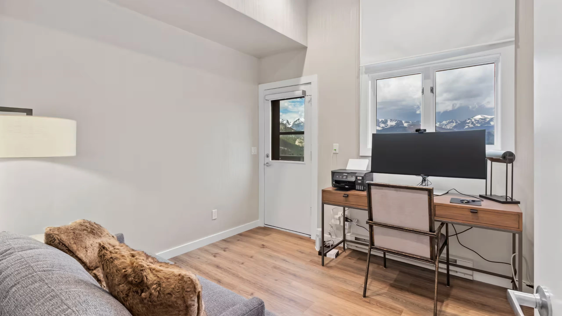 Dedicated writing nook with ultrawide monitor and mountain views
